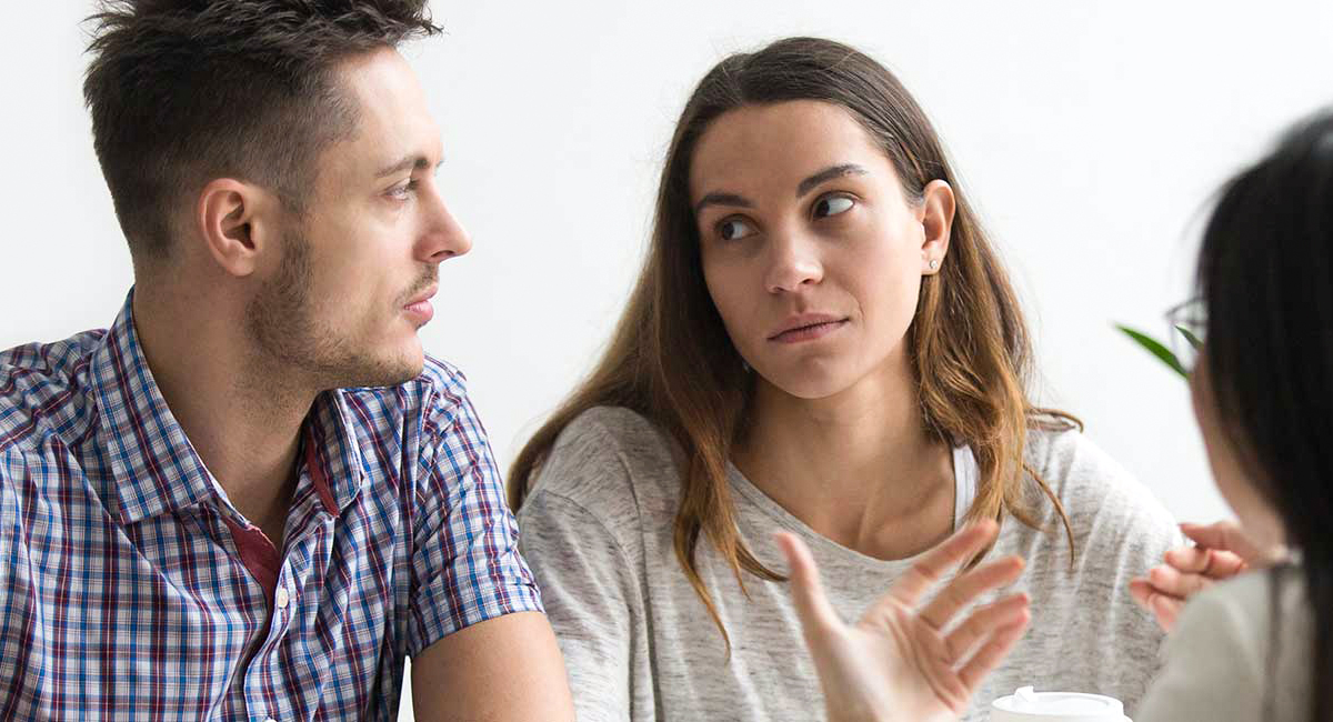 People having a conversation in a noisy environment